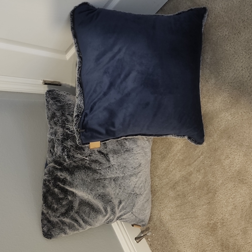 2 navy blue UGG pillows